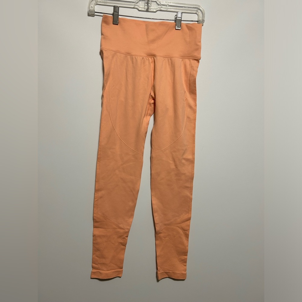 Stretchy, ruched apriocot-orange leggings, originally from Shein